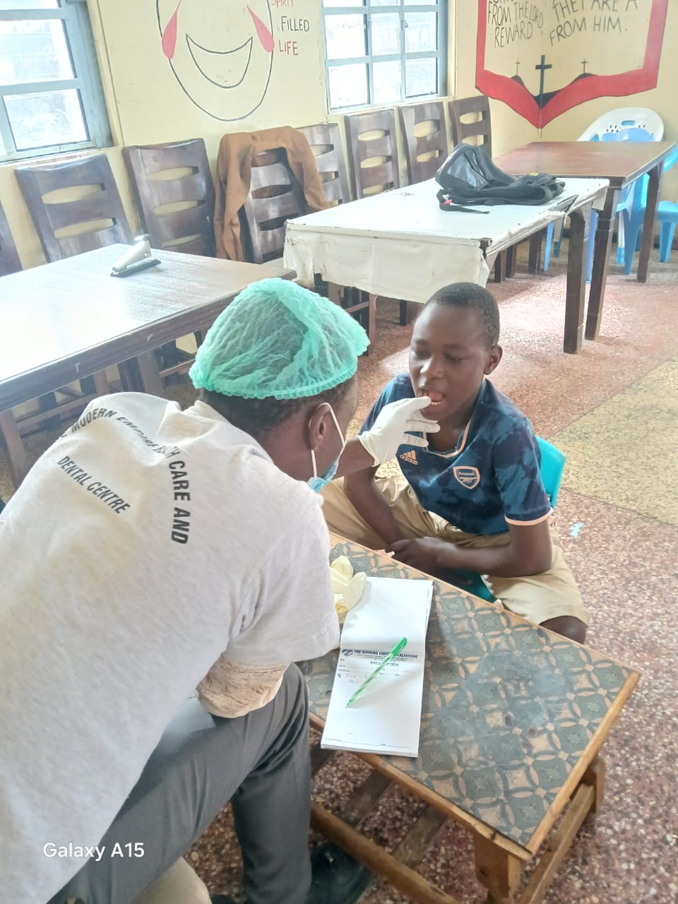 A health worker checking a child at the home
